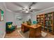 Beautiful office space with wood desk, bookcase, and comfortable seating is perfect for working at home at 708 Edgeley Ln, Lawrenceville, GA 30044