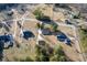 Aerial view of multiple homesites with mature trees and long driveways at 140 Moseley Dr, Stockbridge, GA 30281