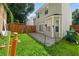 Backyard with green grass and a patio with torches at 1955 Shawn Wayne Se Cir, Atlanta, GA 30316