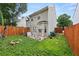 The backyard features a wooden fence, green grass, and a small patio at 1955 Shawn Wayne Se Cir, Atlanta, GA 30316