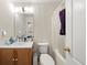Bright bathroom featuring a combination tub and shower, single sink vanity, and ample lighting at 1955 Shawn Wayne Se Cir, Atlanta, GA 30316