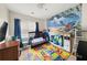 Bright bedroom with a crib and a large colorful alphabet mat at 1955 Shawn Wayne Se Cir, Atlanta, GA 30316