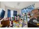 Bright bedroom featuring a bright accent wall, large windows, and plenty of space at 1955 Shawn Wayne Se Cir, Atlanta, GA 30316