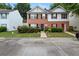 A townhome with well-kept lawn and landscaping, complemented by brick and siding accents at 1955 Shawn Wayne Se Cir, Atlanta, GA 30316