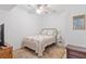 Comfortable bedroom with a ceiling fan, TV, and furniture at 200 Whispering Pines Dr, Woodstock, GA 30188