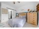 Bright bedroom features custom wainscoting, a modern ceiling fan, and generous natural light at 200 Whispering Pines Dr, Woodstock, GA 30188