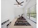 Bright and spacious exercise room with windows, fan, and modern workout equipment at 200 Whispering Pines Dr, Woodstock, GA 30188
