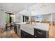 Bright, modern kitchen with large island featuring a farmhouse sink and stylish decor at 200 Whispering Pines Dr, Woodstock, GA 30188