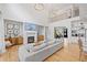 Comfortable living room featuring a fireplace, TV, stylish decor and hardwood floors at 200 Whispering Pines Dr, Woodstock, GA 30188