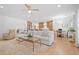Spacious open-concept living room with a modern design, dining area, and hardwood flooring at 200 Whispering Pines Dr, Woodstock, GA 30188
