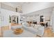 Spacious living room featuring hardwood floors, modern lighting, and an open layout at 200 Whispering Pines Dr, Woodstock, GA 30188
