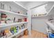 Spacious pantry with white shelving providing ample storage for food and household items at 200 Whispering Pines Dr, Woodstock, GA 30188