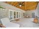 Covered patio with a ceiling fan, outdoor seating and sliding glass doors to the interior at 200 Whispering Pines Dr, Woodstock, GA 30188