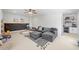 Spacious playroom with alphabet rug, comfortable seating, wet bar and chalkboard wall at 200 Whispering Pines Dr, Woodstock, GA 30188