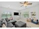 Playroom featuring a comfortable sofa, built-in shelves, and plenty of natural light at 200 Whispering Pines Dr, Woodstock, GA 30188