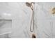 Elegant shower with marble tile and a rainfall shower head perfect for relaxation at 200 Whispering Pines Dr, Woodstock, GA 30188