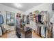 Spacious walk-in closet with custom shelving and center island for optimal organization at 200 Whispering Pines Dr, Woodstock, GA 30188