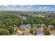Aerial view of Sharon Springs Park homes nestled among lush trees and greenery at 2430 Hemrick Rd, Cumming, GA 30041