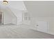 Spacious unfinished attic featuring plush carpet flooring, ample storage, and a neutral color palette at 2430 Hemrick Rd, Cumming, GA 30041