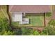 An aerial view of a backyard with a well-manicured lawn, wooden deck and privacy fence at 2430 Hemrick Rd, Cumming, GA 30041
