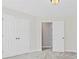 Bedroom featuring neutral walls, carpet, door to bathroom, and large closet at 2430 Hemrick Rd, Cumming, GA 30041
