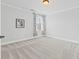 Simple bedroom with neutral carpet, picture window, and great natural light at 2430 Hemrick Rd, Cumming, GA 30041