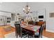 Open concept home with a dining area situated between the kitchen and living room at 2430 Hemrick Rd, Cumming, GA 30041