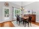 Bright dining area featuring hardwood floors, a decorative rug and access to deck at 2430 Hemrick Rd, Cumming, GA 30041