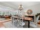 Open floor plan featuring a dining area flowing into the living room and kitchen at 2430 Hemrick Rd, Cumming, GA 30041