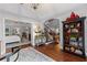 Inviting foyer with hardwood floors, staircase, and views into the dining and living areas at 2430 Hemrick Rd, Cumming, GA 30041