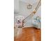 Stately foyer with hardwood floors, a staircase with iron spindles, and an open floor plan at 2430 Hemrick Rd, Cumming, GA 30041