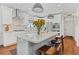 Modern kitchen with white cabinets, marble countertops, stainless steel appliances, and a center island at 2430 Hemrick Rd, Cumming, GA 30041