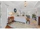 Spacious main bedroom featuring a tray ceiling, patterned rug, and ample natural light at 2430 Hemrick Rd, Cumming, GA 30041