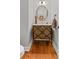 Stylish powder room with marble countertop, hardwood floors and unique vanity at 2430 Hemrick Rd, Cumming, GA 30041