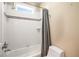 Well-lit bathroom featuring a white tiled shower and tub combo with a modern shower head at 315 Melrose Ave, Decatur, GA 30030