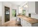 Bathroom showcases a dual sink vanity with granite countertops and custom cabinets at 315 Melrose Ave, Decatur, GA 30030