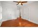 Bedroom boasts hardwood floors, ceiling fan, and closet doors for ample storage at 315 Melrose Ave, Decatur, GA 30030