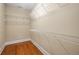 Walk-in closet featuring hardwood floors, ample storage space and wire shelving at 315 Melrose Ave, Decatur, GA 30030