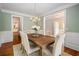 Beautiful dining room with hardwood floors, chandelier, and seating for six at 315 Melrose Ave, Decatur, GA 30030