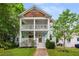 Charming two-story home featuring a double porch, wooden accents, and inviting curb appeal at 315 Melrose Ave, Decatur, GA 30030