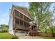 Multi-story home featuring double screened porches, wooden siding, and a two-car garage at 315 Melrose Ave, Decatur, GA 30030