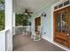 Inviting front porch with rocking chairs, ceiling fan, and classic wooden door at 315 Melrose Ave, Decatur, GA 30030