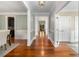 Elegant hallway featuring hardwood floors, decorative trim, and a view of the front porch at 315 Melrose Ave, Decatur, GA 30030