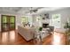 Bright living room with hardwood floors, fireplace, and coffered ceiling at 315 Melrose Ave, Decatur, GA 30030