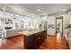 Open concept of kitchen and living room featuring hardwood floors and modern fireplace at 315 Melrose Ave, Decatur, GA 30030