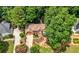 Aerial view of a large brick home with mature trees at 3741 Bays Ferry Way, Marietta, GA 30062