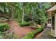 A backyard with a stone staircase and lush greenery at 3741 Bays Ferry Way, Marietta, GA 30062