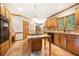Well-equipped kitchen with stone tile floors, a center island, and wooden cabinetry throughout at 3741 Bays Ferry Way, Marietta, GA 30062