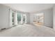 Open living room with three windows, neutral carpet and direct access to the staircase at 3741 Bays Ferry Way, Marietta, GA 30062
