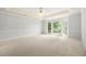 Spacious and bright, the main bedroom has neutral carpeting and a tray ceiling at 3741 Bays Ferry Way, Marietta, GA 30062